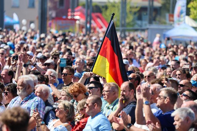 01 May 2026, Saxony-Anhalt, Schoenebeck: Alternative for Germany (AfD) supporters take part in the European Family Festival organized by the ESN party (Europe of Sovereign Nations) on Salzblume Square. Photo: Peter Gercke/dpa