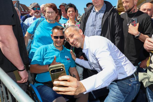 01 May 2026, Saxony-Anhalt, Schoenebeck: Alternative for Germany (AfD) lead candidate Ulrich Siegmund takes a selfie at the European Family Festival organized by the ESN party (Europe of Sovereign Nations) on Salzblume Square. Photo: Peter Gercke/dpa