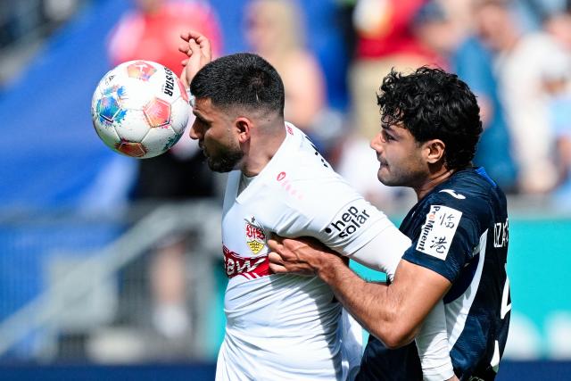 02 May 2026, Baden-Wuerttemberg, Sinsheim: Stuttgart's Deniz Undav (L) and Hoffenheim's Ozan Kabak battle for the ball during the German Bundesliga soccer match between TSG 1899 Hoffenheim and VfB Stuttgart at PreZero Arena. Photo: Uwe Anspach/dpa - WICHTIGER HINWEIS: Gemäß den Vorgaben der DFL Deutsche Fußball Liga bzw. des DFB Deutscher Fußball-Bund ist es untersagt, in dem Stadion und/oder vom Spiel angefertigte Fotoaufnahmen in Form von Sequenzbildern und/oder videoähnlichen Fotostrecken zu verwerten bzw. verwerten zu lassen.
