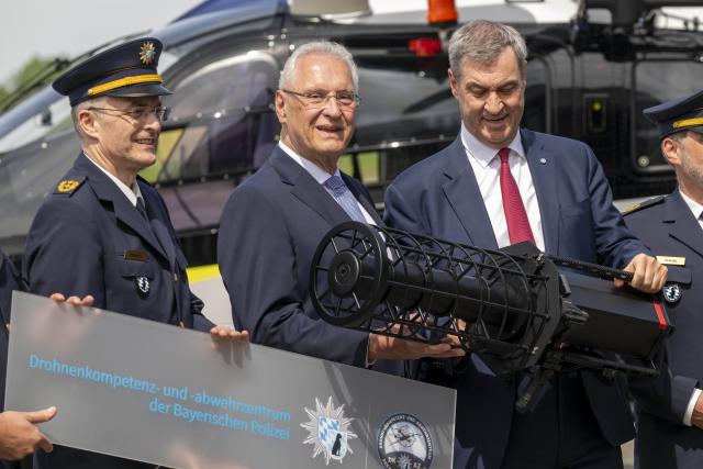 04 May 2026, Bavaria, Erding: Joachim Herrmann, (L) Bavarian Minister of the Interior, for Sport and Integration, and Markus Soeder (R), Prime Minister of Bavaria, attend the opening of the Drone Competence and Defense Center. Photo: Peter Kneffel/dpa