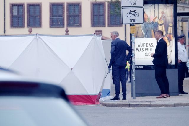 04 May 2026, Saxony, Leipzig: Armin Schuster, Minister of the Interior of the state of Saxony, stands by the shielded vehicle, after a car crashes into a group of people in Leipzig. Photo: Sebastian Willnow/dpa