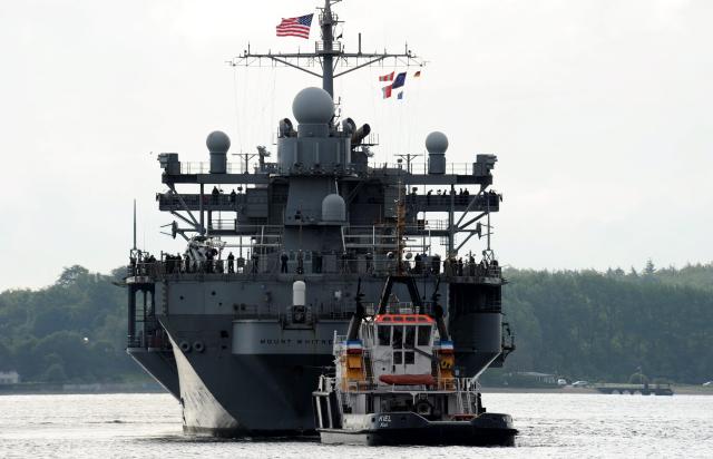FILED - 17 June 2011, Schleswig-Holstein, Kiel: FILE PHOTO - The swimming command centre of the 6th US navy, the 'USS Mount Whitney', is taken to its specially saved mooring by tugboats at the naval port in Kiel, Germany. Photo: picture alliance / dpa