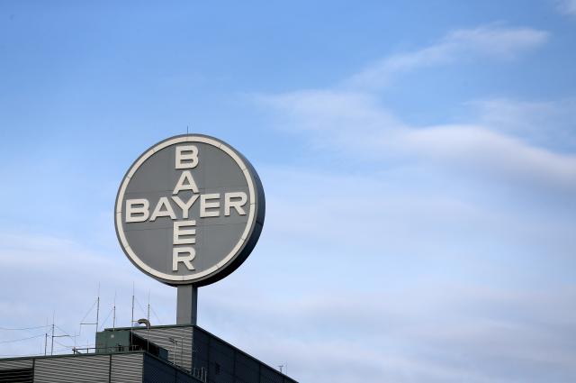 FILED - 22 October 2013, Saxony-Anhalt, Bitterfeld-Wolfen: View of the logo of German chemical and pharmaceutical company Bayer AG on the roof of a building of Bayer Bitterfeld GmbH in Bitterfeld-Wolfen. Photo: Jan Woitas/dpa-Zentralbild/dpa