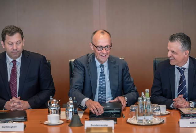 06 May 2026, Berlin: German Chancellor Friedrich Merz (C) sits next to Lars Klingbeil (L), Federal Minister of Finance, and Thorsten Frei, Head of the Federal Chancellery and Federal Minister for Special Tasks, at the start of the meeting of the Federal Cabinet in the Chancellery. The meeting takes place on the first anniversary of the Black-Red Federal Government under Chancellor Merz. Photo: Michael Kappeler/dpa