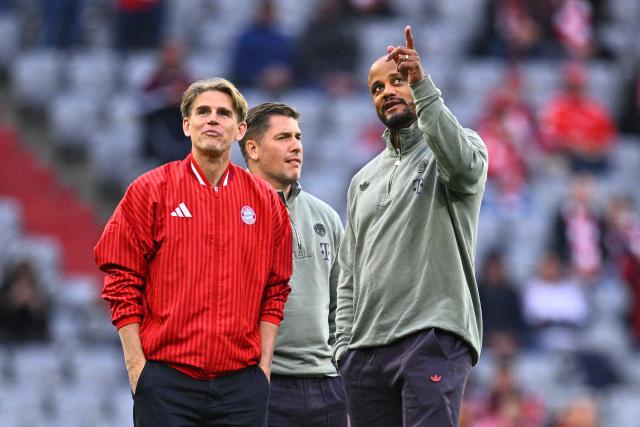06 May 2026, Bavaria, Munich: Bayern Munich coach Vincent Kompany talks to sports director Christoph Freund (L) during a pitch inspection before the UEFA Champions League semi-final, second leg soccer match between Bayern Munich and Paris Saint-Germain at the Allianz Arena. Photo: Tom Weller/dpa