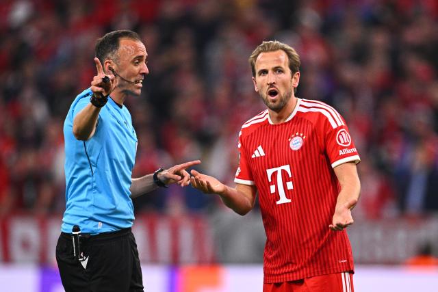 06 May 2026, Bavaria, Munich: Referee Joao Pinheiro talks to Bayern Munich's Harry Kane during the UEFA Champions League semi-final, second leg soccer match between Bayern Munich and Paris Saint-Germain at the Allianz Arena. Photo: Tom Weller/dpa