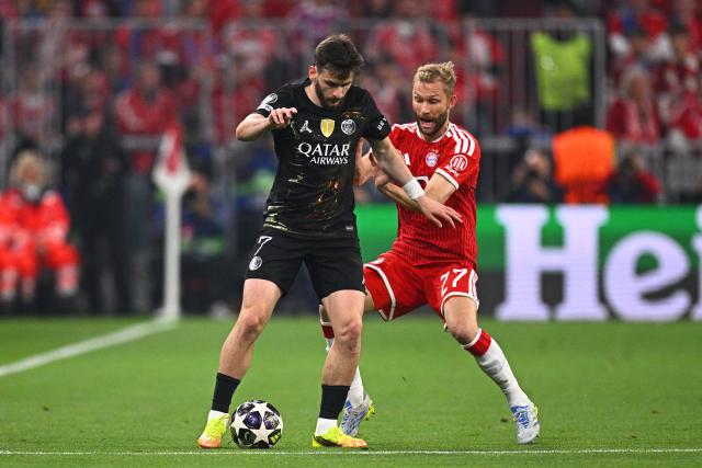 06 May 2026, Bavaria, Munich: Bayern Munich's Konrad Laimer and Paris Saint-Germain's Khvicha Kvaratskhelia battle for the ball during the UEFA Champions League semi-final, second leg soccer match between Bayern Munich and Paris Saint-Germain at the Allianz Arena. Photo: Tom Weller/dpa