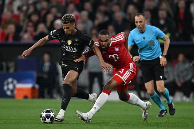 06 May 2026, Bavaria, Munich: Paris Saint-Germain's Desire Doue in action against Bayern Munich's Jonathan Tah (R) during the UEFA Champions League semi-final, second leg soccer match between Bayern Munich and Paris Saint-Germain at the Allianz Arena. Photo: Sven Hoppe/dpa
