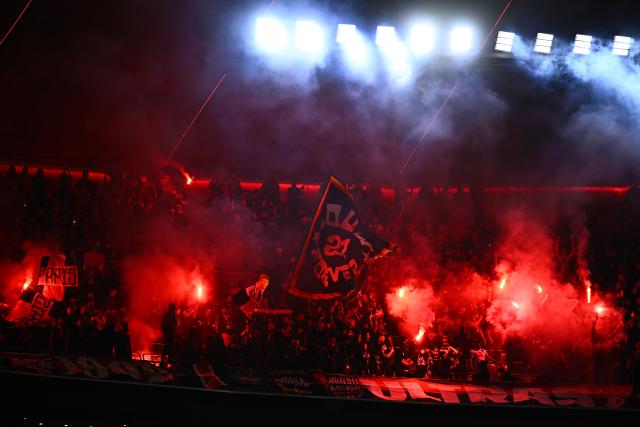 06 May 2026, Bavaria, Munich: Paris Saint-Germain fans cheer with flares in the stands during the UEFA Champions League semi-final, second leg soccer match between Bayern Munich and Paris Saint-Germain at the Allianz Arena. Photo: Tom Weller/dpa