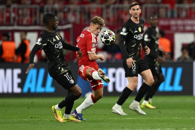 06 May 2026, Bavaria, Munich: Paris Saint-Germain's Ousmane Dembele (L) and Bayern Munich's Joshua Kimmich battle for the ball during the UEFA Champions League semi-final, second leg soccer match between Bayern Munich and Paris Saint-Germain at the Allianz Arena. Photo: Sven Hoppe/dpa