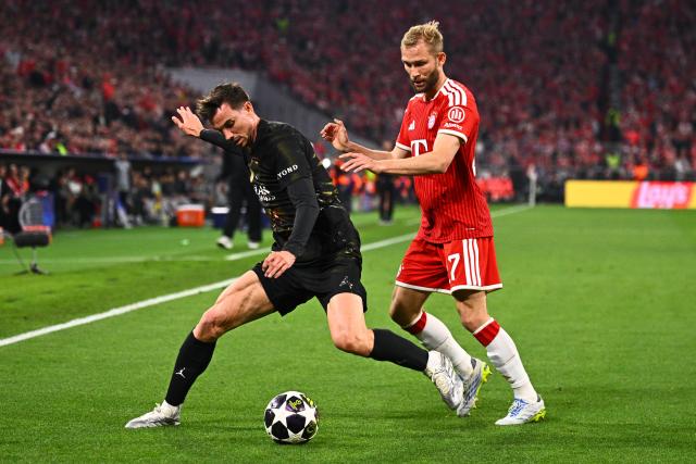 06 May 2026, Bavaria, Munich: Paris Saint-Germain's Fabian Ruiz and Bayern Munich's Konrad Laimer (R) battle for the ball during the UEFA Champions League semi-final, second leg soccer match between Bayern Munich and Paris Saint-Germain at the Allianz Arena. Photo: Tom Weller/dpa