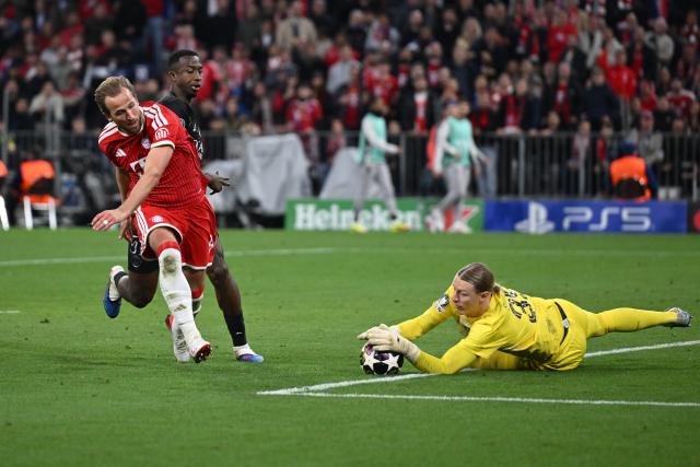 06 May 2026, Bavaria, Munich: Bayern Munich's Harry Kane in action against Paris Saint-Germain's Willian Pacho and goalkeeper Matvey Safonov (R) during the UEFA Champions League semi-final, second leg soccer match between Bayern Munich and Paris Saint-Germain at the Allianz Arena. Photo: Sven Hoppe/dpa