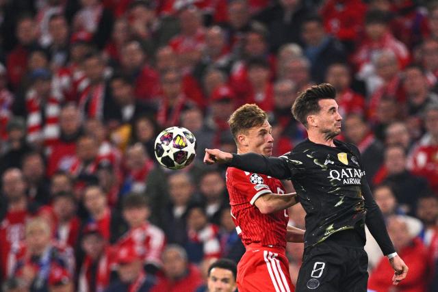 FILED - 06 May 2026, Bavaria, Munich: Bayern Munich's Joshua Kimmich and Paris Saint-Germain's Fabian Ruiz battle for a header during the UEFA Champions League semi-final, second leg soccer match between Bayern Munich and Paris Saint-Germain at the Allianz Arena. Photo: Tom Weller/dpa