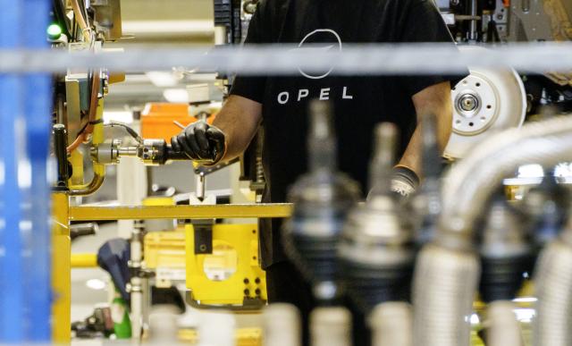FILED - 08 June 2024, Hesse, Ruesselsheim: FILE PHOTO - An Opel employee works on a vehicle on Montage Street. Photo: Andreas Arnold/dpa