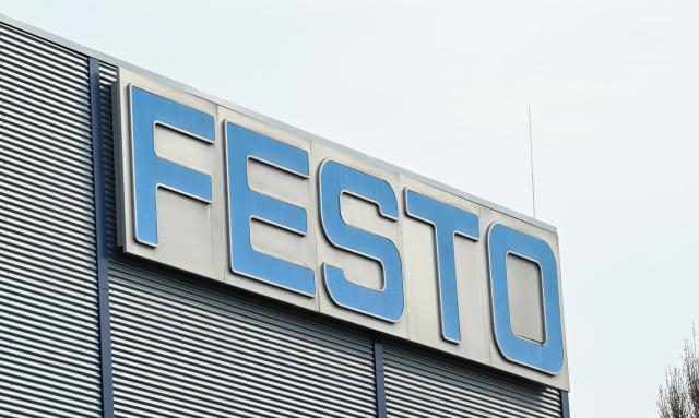 FILED - 21 March 2024, Baden-Württemberg, Eßlingen: FILE PHOTO - The logo of the Industrial plant manufacturer Festo is pictured on a building at the company headquarters in Esslingen. Photo: Bernd Weißbrod/dpa