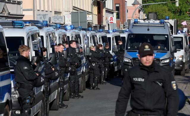 08 May 2026, Mecklenburg-Western Pomerania, Demmin: Police officers stand guard during a counter-demonstration against a Nazi march. Every year on 8 May, the party "Die Heimat" organizes a so-called funeral march in Demmin, with protests and counter-demonstrations taking place in the town. Photo: Bernd Wüstneck/dpa