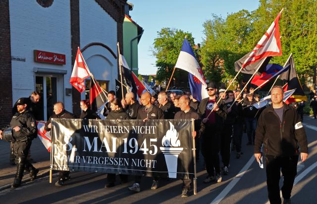 08 May 2026, Mecklenburg-Western Pomerania, Demmin: Right-wing extremists march through the town during the so-called funeral march, organized by the The Homeland
(Die Heimat) party. Photo: Bernd Wüstneck/dpa