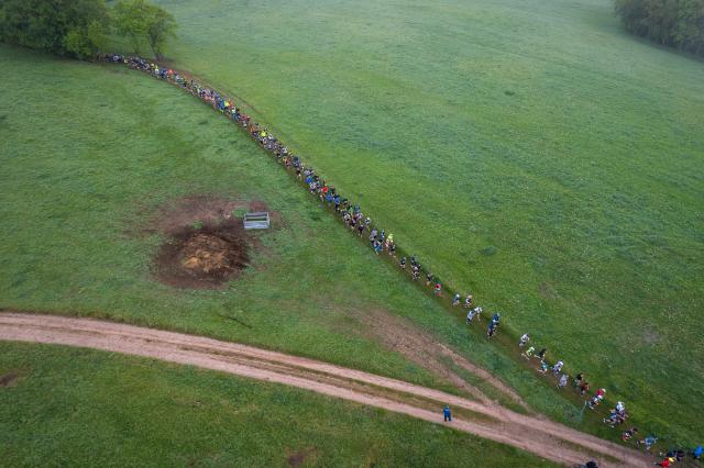 09 May 2026, Thuringia, Eisenach: An aerial view shows runners shortly after the start of the super marathon course near Eisenach during the 53rd GutsMuths Rennsteig Run in the Thuringian Forest. Featuring several courses, including the 73.9-kilometre super marathon, the event is considered one of Europe's largest and most traditional cross-country races. Photo: Jacob Schröter/dpa