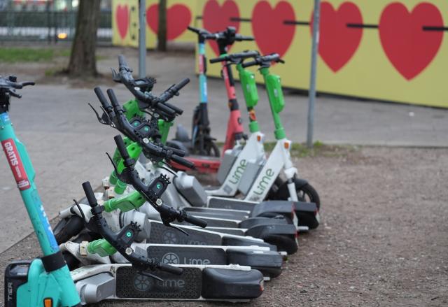 FILED - 19 December 2025, Hamburg: FILE PHOTO - E-scooters from various suppliers are parked in the city center. Photo: Marcus Brandt/dpa