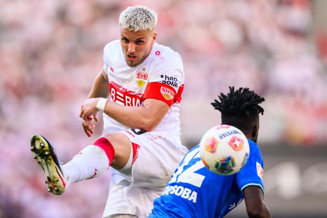 09 May 2026, Stuttgart: Stuttgart's Ermedin Demirovic and Bayer Leverkusen's Edmond Tapsoba battle for the ball during the German Bundesliga soccer match between VfB Stuttgart and Bayer 04 Leverkusen at the MHPArena. Photo: Tom Weller/dpa - IMPORTANT NOTICE: DFL and DFB regulations prohibit any use of photographs as image sequences and/or quasi-video.