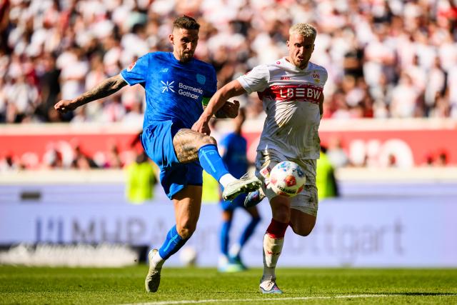 09 May 2026, Stuttgart: Bayer Leverkusen's Robert Andrich and Stuttgart's Ermedin Demirovic battle for the ball during the German Bundesliga soccer match between VfB Stuttgart and Bayer 04 Leverkusen at the MHPArena. Photo: Tom Weller/dpa - IMPORTANT NOTICE: DFL and DFB regulations prohibit any use of photographs as image sequences and/or quasi-video.