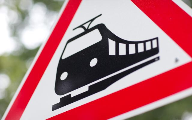 FILED - 01 September 2013, Lower Saxony, Rieste: FILE PHOTO - A view of a warning sign for an unguarded railroad crossing. Photo: Friso Gentsch/dpa