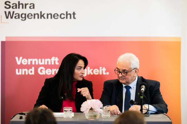 10 May 2026, Berlin: Sergej Netschajew (R), Russia's ambassador to Germany, and Sevim Dagdelen, member of the BSW Federal Board and leading candidate of BSW Berlin-Mitte for the Berlin parliamentary elections, sit on the podium before the start of a BSW matinee. Under the motto "Peace through dialog", BSW politician Dagdelen invites the Russian ambassador to a discussion. Photo: Christoph Soeder/dpa
