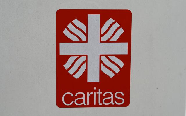 FILED - 21 March 2025, Bavaria, Munich: FILE PHOTO - A sign with the Caritas logo is pictured in Munich. Photo: Leonie Asendorpf/dpa