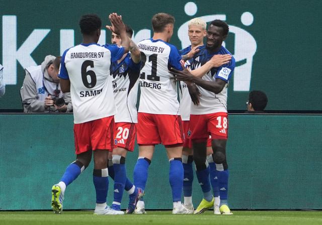 10 May 2026, Hamburg: Hamburger's Bakery Jatta (R) celebrates scoring his side's first goal during the German Bundesliga soccer match between Hamburger SV and SC Freiburg at Volksparkstadion. Photo: Marcus Brandt/dpa - IMPORTANT NOTE: In accordance with the regulations of the DFL German Football League and the DFB German Football Association, it is prohibited to utilize or have utilized photographs taken in the stadium and/or of the match in the form of sequential images and/or video-like photo series.