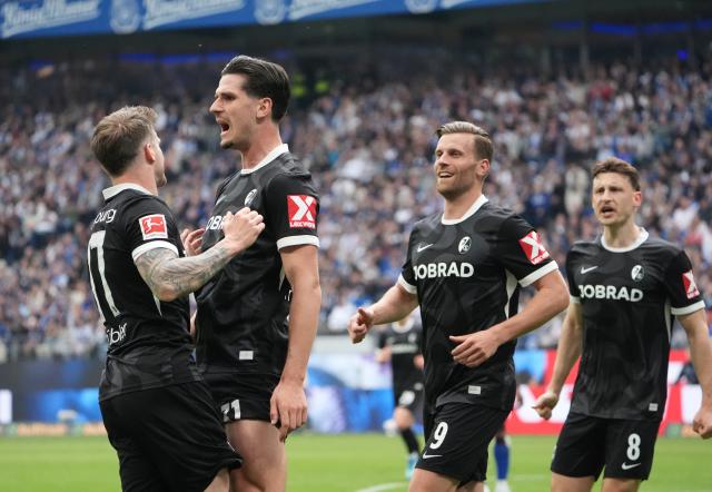 10 May 2026, Hamburg: Freiburg's Igor Matanovic celebrates scoring his side's first goal during the German Bundesliga soccer match between Hamburger SV and SC Freiburg at Volksparkstadion. Photo: Marcus Brandt/dpa - IMPORTANT NOTE: In accordance with the regulations of the DFL German Football League and the DFB German Football Association, it is prohibited to utilize or have utilized photographs taken in the stadium and/or of the match in the form of sequential images and/or video-like photo series.