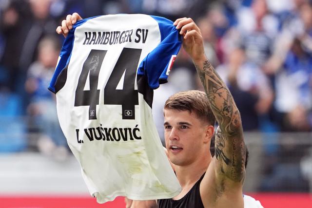 10 May 2026, Hamburg: Hamburger's Luka Vuskovic celebrates scoring his side's second goal during the 
German Bundesliga soccer match between Hamburger SV and SC Freiburg at Volksparkstadion. Photo: Marcus Brandt/dpa - IMPORTANT NOTE: In accordance with the regulations of the DFL German Football League and the DFB German Football Association, it is prohibited to utilize or have utilized photographs taken in the stadium and/or of the match in the form of sequential images and/or video-like photo series.