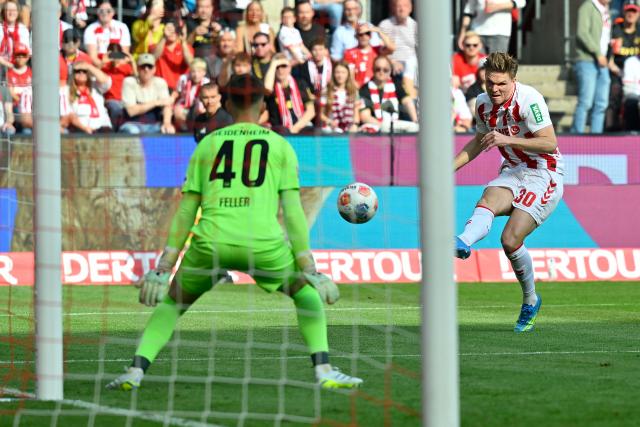 10 May 2026, North Rhine-Westphalia, Cologne: Cologne's Marius Buelter  scores his side's first goal during the German Bundesliga soccer match between 1.FC Cologne and 1.FC Heidenheim at RheinEnerg
ieStadion. Photo: Ulrich Hufnagel/dpa - IMPORTANT NOTE: In accordance with the regulations of the DFL German Football League and the DFB German Football Association, it is prohibited to utilize or have utilized photographs taken in the stadium and/or of the match in the form of sequential images and/or video-like photo series.