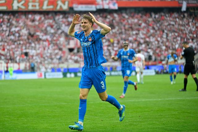 10 May 2026, North Rhine-Westphalia, Cologne: Heidenheim's Jan Schoeppner celebrates scoring his side's third goal during the German Bundesliga soccer match between 1.FC Cologne and 1.FC Heidenheim at RheinEnergieStadion. Photo: Ulrich Hufnagel/dpa - IMPORTANT NOTE: In accordance with the regulations of the DFL German Football League and the DFB German Football Association, it is prohibited to utilize or have utilized photographs taken in the stadium and/or of the match in the form of sequential images and/or video-like photo series.