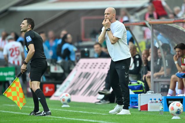 10 May 2026, North Rhine-Westphalia, Cologne: Cologne coach Rene Wagner whistles during the German Bundesliga soccer match between 1.FC Cologne and 1.FC Heidenheim at RheinEnergieStadion. Photo: Ulrich Hufnagel/dpa - IMPORTANT NOTE: In accordance with the regulations of the DFL German Football League and the DFB German Football Association, it is prohibited to utilize or have utilized photographs taken in the stadium and/or of the match in the form of sequential images and/or video-like photo series.