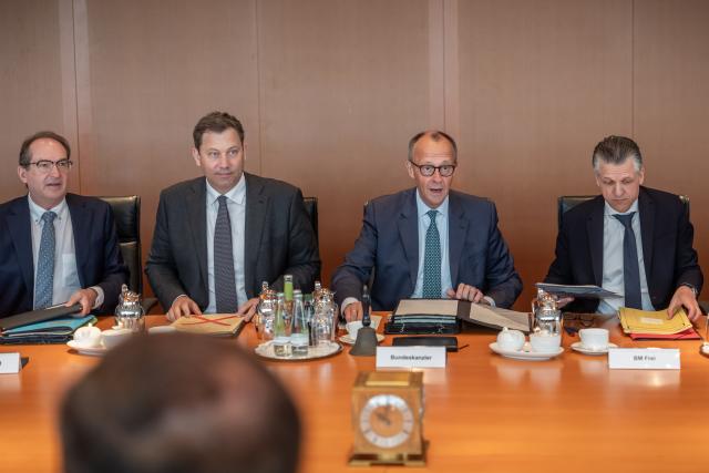 13 May 2026, Berlin: German Chancellor Friedrich Merz (3-L) speaks alongside Lars Klingbeil, German Minister of Finance, Alexander Dobrindt (L), German Minister of the Interior, and Thorsten Frei (R), Head of the German Chancellery and German Minister for Special Tasks, at the start of the meeting of the Federal Cabinet in the Chancellery. Photo: Michael Kappeler/dpa