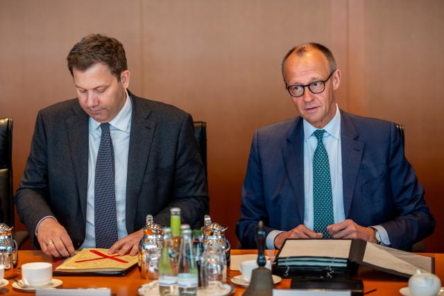 13 May 2026, Berlin: German Chancellor Friedrich Merz (R) speaks next to Lars Klingbeil, German Minister of Finance, at the start of the German Cabinet meeting in the Chancellery. Photo: Michael Kappeler/dpa