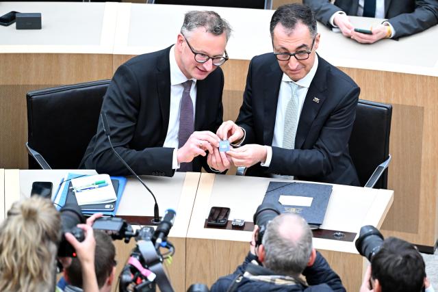 13 May 2026, Baden-Württemberg, Stuttgart: Andreas Schwarz (L), Chairman of the Green Party parliamentary group in Baden-Wuerttemberg, and Cem Ozdemir, designated Minister President of Baden-Wuerttemberg, sit in the state parliament. Ozdemir  is to be elected as the new Minister President of Baden-Wuerttemberg in the state parliament. Photo: Bernd Weißbrod/dpa