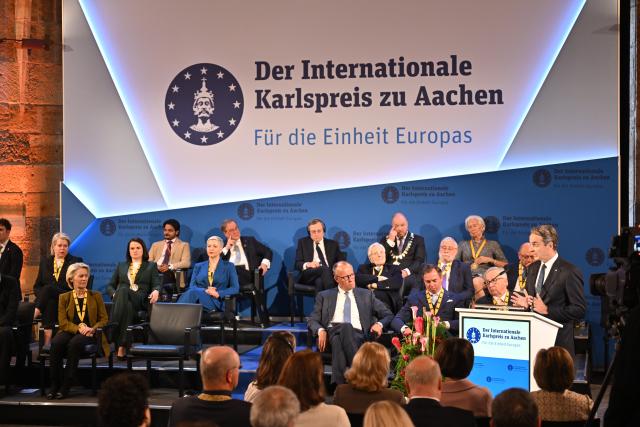 14 May 2026, North Rhine-Westphalia, Aachen: Kyriakos Mitsotakis, Prime Minister of Greece, delivers a speech during the Charlemagne Prize award ceremony in Aachen City Hall. Former President of the European Central Bank (ECB), Mario Draghi, is to be awarded the Charlemagne Prize 2026. Photo: Henning Kaiser/dpa