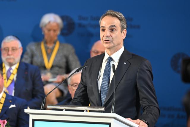 14 May 2026, North Rhine-Westphalia, Aachen: Kyriakos Mitsotakis, Prime Minister of Greece, delivers a speech during the Charlemagne Prize award ceremony in Aachen City Hall. Former President of the European Central Bank (ECB), Mario Draghi, is to be awarded the Charlemagne Prize 2026. Photo: Henning Kaiser/dpa