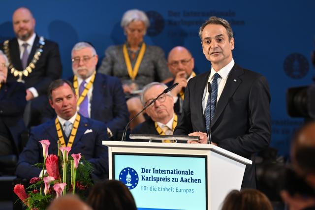 14 May 2026, North Rhine-Westphalia, Aachen: Kyriakos Mitsotakis, Prime Minister of Greece, delivers a speech during the Charlemagne Prize award ceremony in Aachen City Hall. Former President of the European Central Bank (ECB), Mario Draghi, is to be awarded the Charlemagne Prize 2026. Photo: Henning Kaiser/dpa