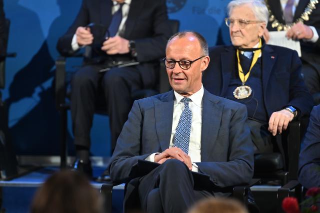 14 May 2026, North Rhine-Westphalia, Aachen: German Chancellor Friedrich Merz attends the Charlemagne Prize award ceremony in City Hall. Former President of the European Central Bank (ECB), Mario Draghi, is to be awarded the Charlemagne Prize 2026. Photo: Henning Kaiser/dpa