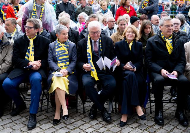 14 May 2026, Bavaria, Wuerzburg: (L-R) Martin Heilig, Lord Mayor of Wuerzburg, Irme Stetter-Karp, President of the Central Committee of German Catholics (ZdK), German President Frank-Walter Steinmeier, his wife Elke Buedenbender and Bishop Heiner Wilmer, Chairman of the German Bishops' Conference, take part in a service at Residenzplatz on the 104th German Catholic Day. Photo: Sven Hoppe/dpa - ATTENTION: editorial use only and only if the credit mentioned above is referenced in full