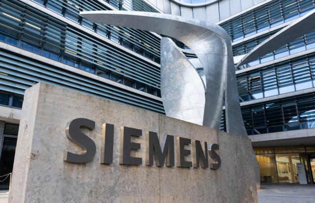 FILED - 09 February 2023, Bavaria, Munich: FILE PHOTO - The "Siemens" sign is pictured in front of the company headquarters in Munich. Photo: Sven Hoppe/dpa