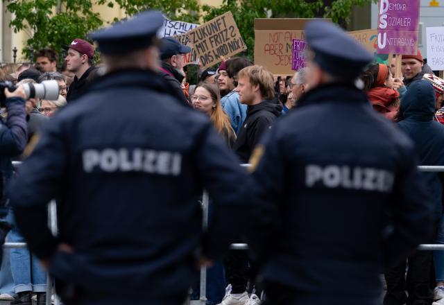 15 May 2026, Bavaria, Wuerzburg: Demonstrators protest against Chancellor Merz's visit at the 104th German Catholic Congress. Photo: Sven Hoppe/dpa - ATTENTION: editorial use only and only if the credit mentioned above is referenced in full