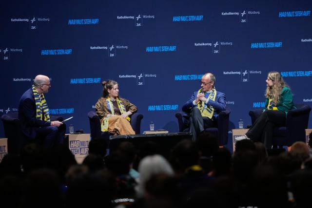 15 May 2026, Bavaria, Wuerzburg: Amy Kirchhoff (2-L), Secretary General of the German National Student Conference, Federal Chancellor Friedrich Merz (3-L) and Lisa Quarch (R), Spiritual Director of the Federation of German Catholic Youth, take part in a panel discussion at the 104th German Catholic Day under the motto "Shaping the future together". Photo: Matthias Schrader/AP Pool/dpa - ATTENTION: For editorial use only and only with full reference to the above credit
