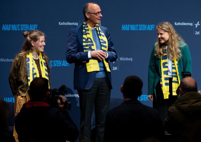 15 May 2026, Bavaria, Wuerzburg: Amy Kirchhoff (l-r), Secretary General of the German Catholic Youth Conference, German Chancellor Friedrich Merz and Lisa Quarch, Spiritual Director of the Federation of German Catholic Youth, take part in a panel discussion at the 104th German Catholic Day under the motto "Shaping the future together". Photo: Sven Hoppe/dpa - ATTENTION: For editorial use only and only with full reference to the above credit