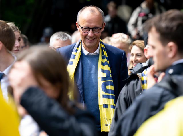 15 May 2026, Bavaria, Wuerzburg: German Chancellor Friedrich Merz takes a tour of the Church Mile at the 104th German Catholic Day. Photo: Sven Hoppe/dpa - ATTENTION: For editorial use only and only with full reference to the above credit