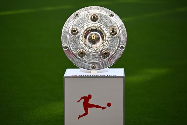 16 May 2026, Bavaria, Munich: The championship trophy is displayed in the stadium before the German Bundesliga soccer match between Bayern Munich and 1. FC Cologne. Photo: Sven Hoppe/dpa - IMPORTANT NOTICE: DFL and DFB regulations prohibit any use of photographs as image sequences and/or quasi-video.