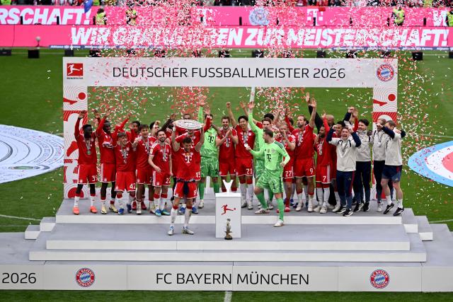 16 May 2026, Bavaria, Munich: Bayern Munich's Leon Goretzka and teammates celebrate winning the German championship with the championship trophy after the German Bundesliga soccer match between Bayern Munich and 1. FC Cologne at Allianz Arena. Photo: Sven Hoppe/dpa - IMPORTANT NOTICE: DFL and DFB regulations prohibit any use of photographs as image sequences and/or quasi-video.
