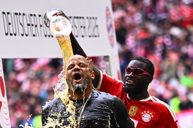 16 May 2026, Bavaria, Munich: Bayern Munich coach Vincent Kompany (L) gets doused with beer by Dayot Upamecano during the championship celebration after the German Bundesliga soccer match between Bayern Munich and 1. FC Cologne at Allianz Arena. Photo: Tom Weller/dpa - IMPORTANT NOTICE: DFL and DFB regulations prohibit any use of photographs as image sequences and/or quasi-video.